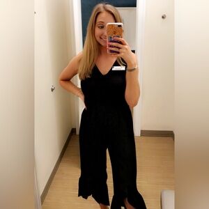 Size small black jumpsuit with ruffled bottoms